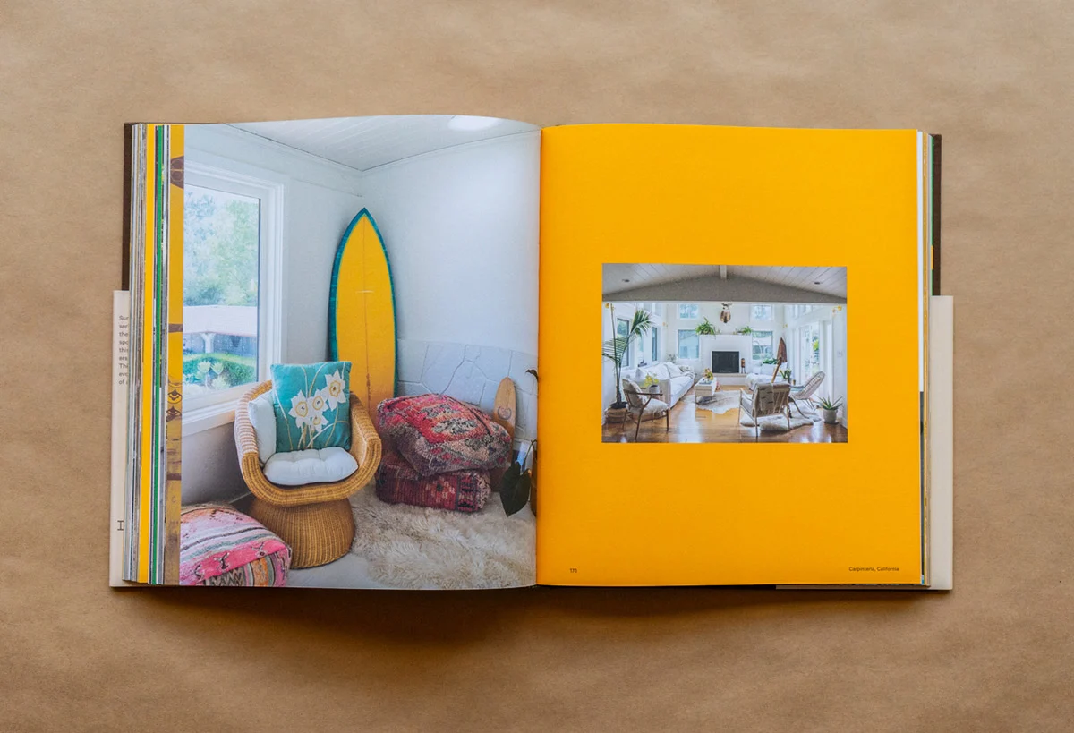 An open book displaying a photograph centered on a vibrant yellow page, with a page number 