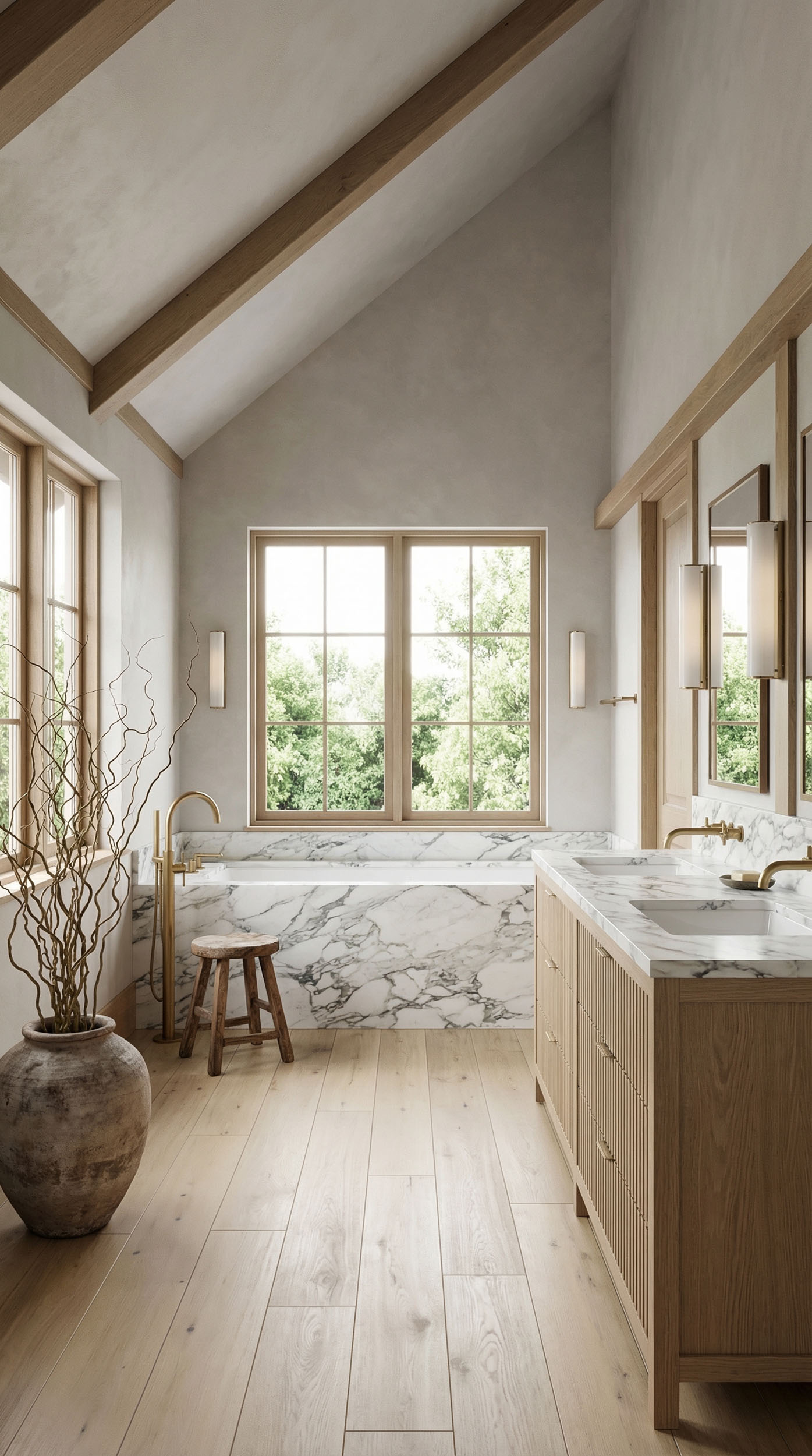 Vaulted bathroom interior featuring a steeply pitched ceiling with exposed timber beams, symmetrical wood-framed fenestration maximizing natural daylight, a marble-clad built-in bathtub, and custom oak millwork against wide-plank wood flooring.